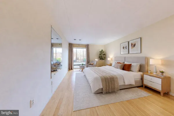 a spacious bedroom with a bed and a couch