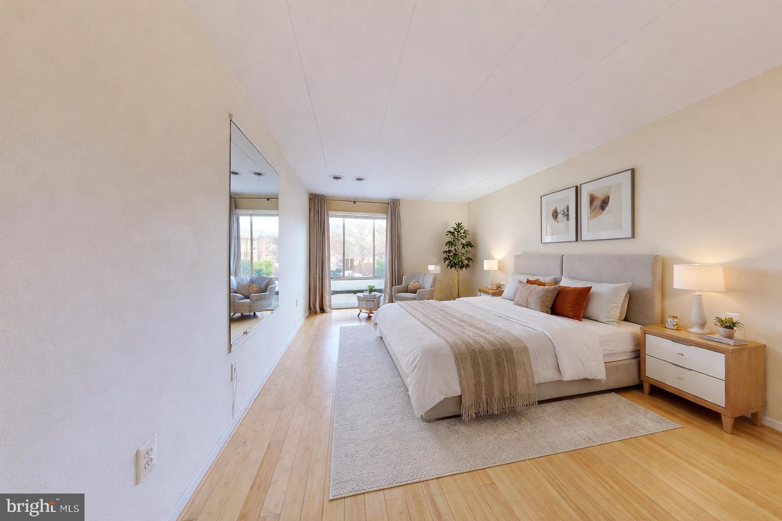 2629 Fort Farnsworth Road, Unit 276 Alexandria, VA 22303 - Photo 6 of 37 a spacious bedroom with a bed and a couch