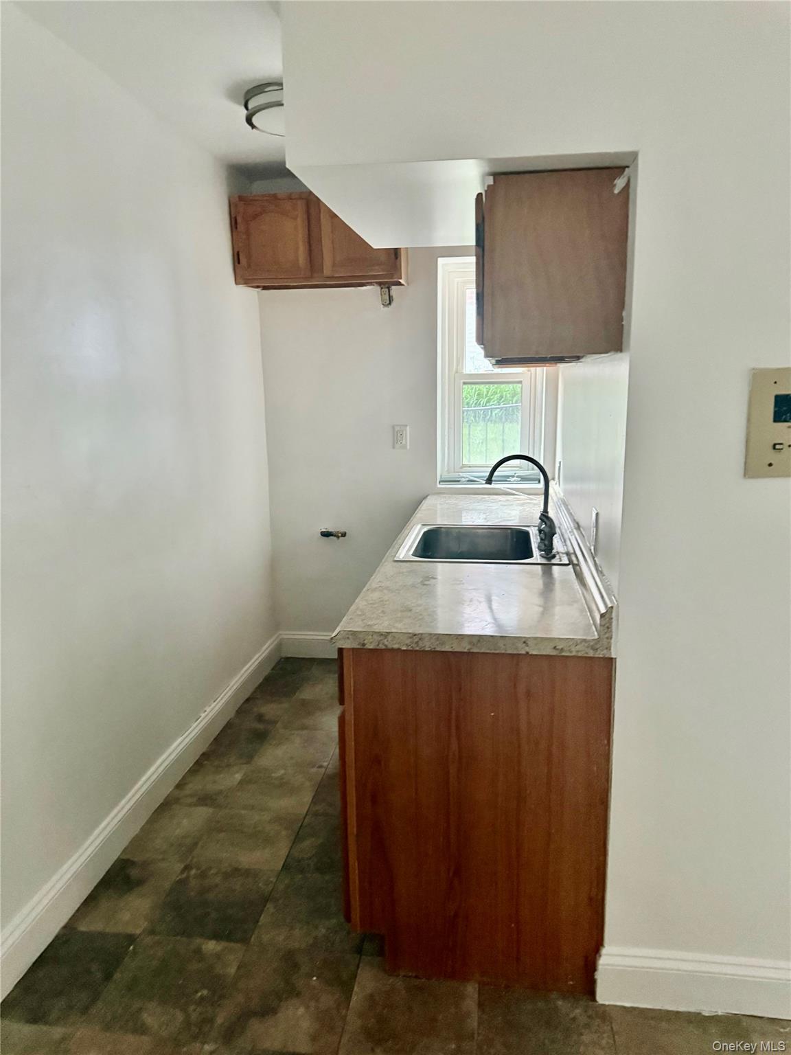 600 Pelham Road, Unit BUILDING B E New Rochelle, NY 10805 - Photo 2 of 7 a bathroom with a sink and vanity