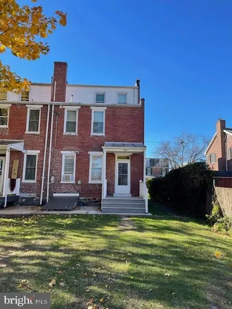 a front view of a house with a swimming pool