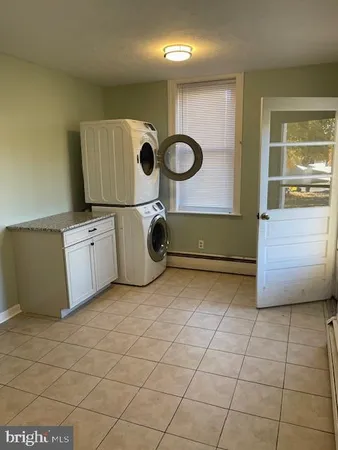 a kitchen with a cabinets and a stove top oven