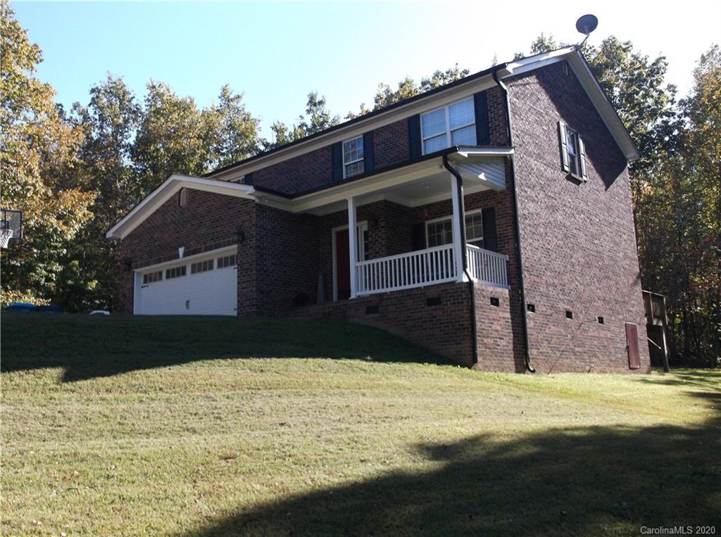 12450 Banks Road Mount Pleasant, NC 28124 - Photo 2 of 43 a front view of a house with a yard