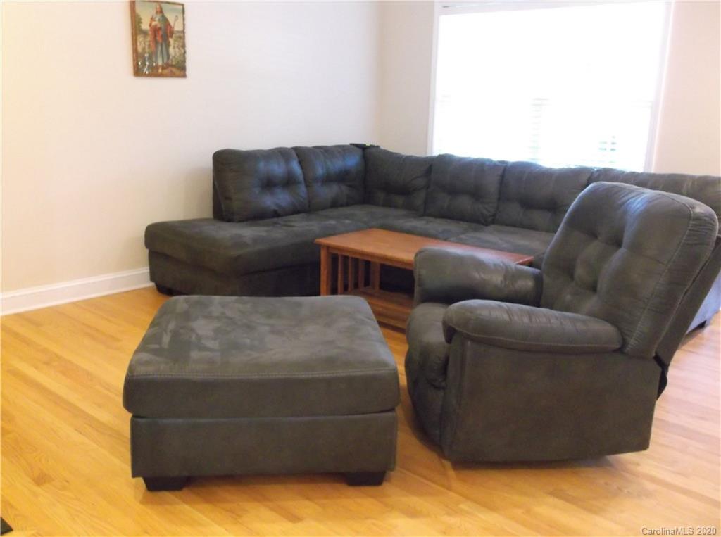 12450 Banks Road Mount Pleasant, NC 28124 - Photo 17 of 43 a living room with furniture and a couch