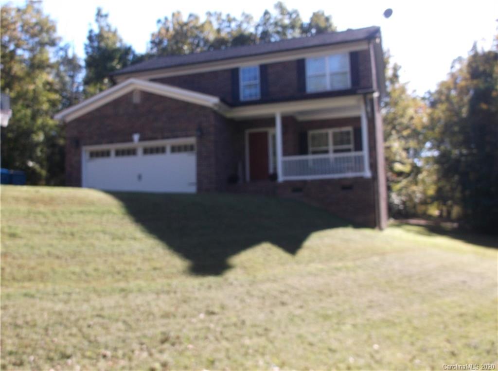 12450 Banks Road Mount Pleasant, NC 28124 - Photo 3 of 43 a front view of a house with a yard