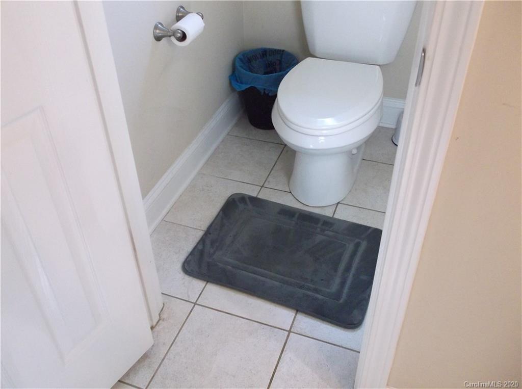 12450 Banks Road Mount Pleasant, NC 28124 - Photo 23 of 43 a bathroom with a toilet and a rug