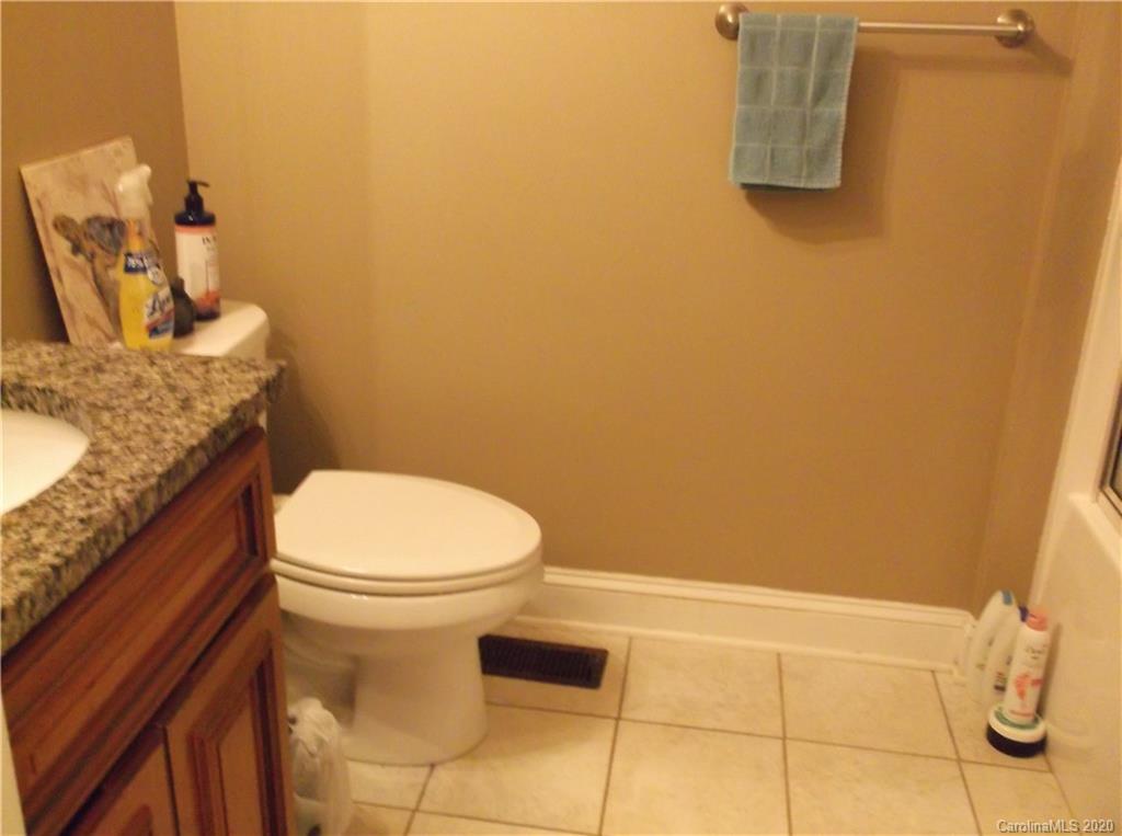 12450 Banks Road Mount Pleasant, NC 28124 - Photo 28 of 43 a bathroom with a toilet and a sink