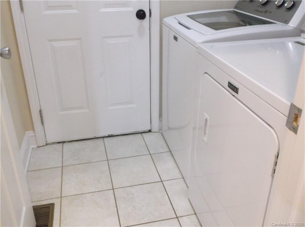 12450 Banks Road Mount Pleasant, NC 28124 - Photo 39 of 43 a view of a storage and utility room with washer and dryer