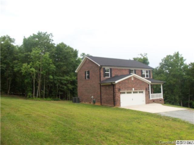 12450 Banks Road Mount Pleasant, NC 28124 - Photo 43 of 43 a view of a house with a yard and tree s