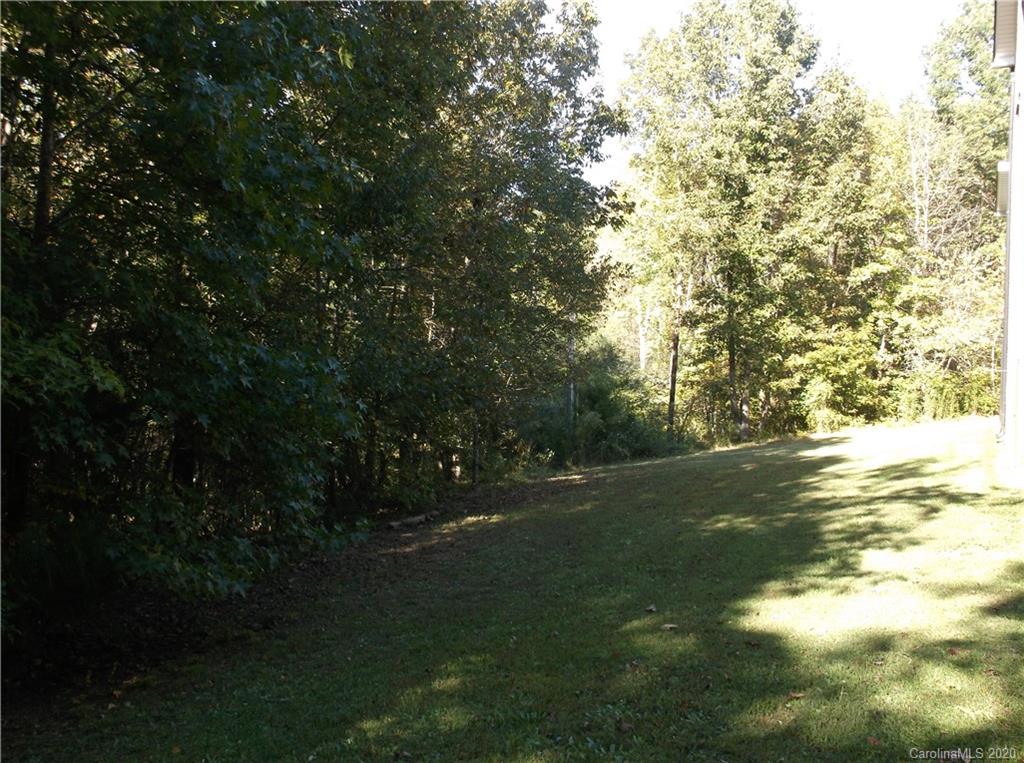 12450 Banks Road Mount Pleasant, NC 28124 - Photo 7 of 43 a view of a field of grass and trees