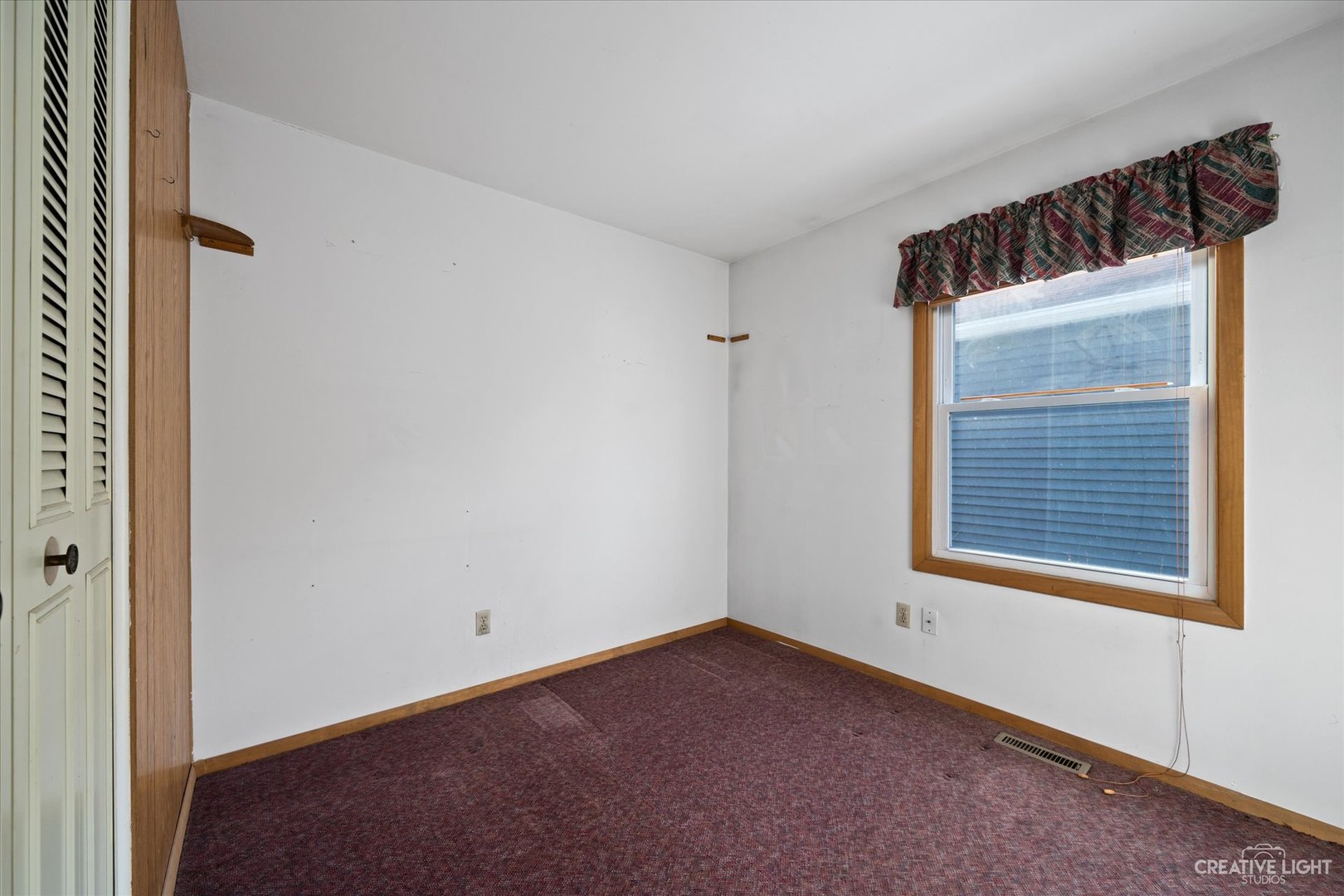 135 Heathgate Road Montgomery, IL 60538 - Photo 11 of 17 a view of an empty room with a window
