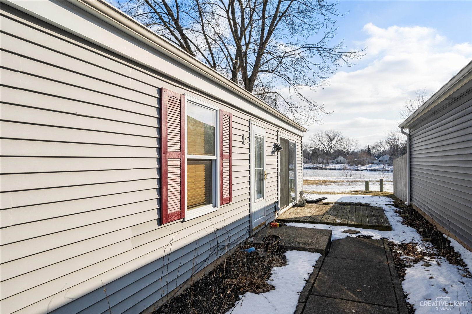 135 Heathgate Road Montgomery, IL 60538 - Photo 17 of 17 a view of a porch with wooden floor and outdoor space