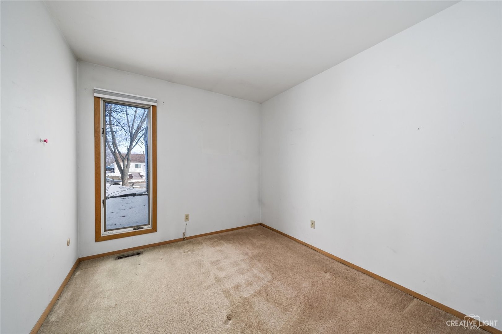 135 Heathgate Road Montgomery, IL 60538 - Photo 9 of 17 an empty room with windows
