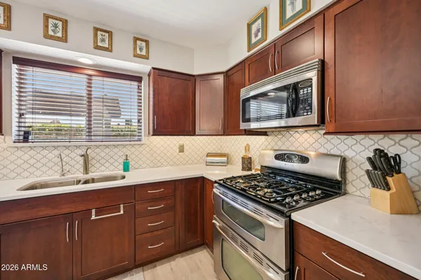 a living room with fireplace furniture and a flat screen tv
