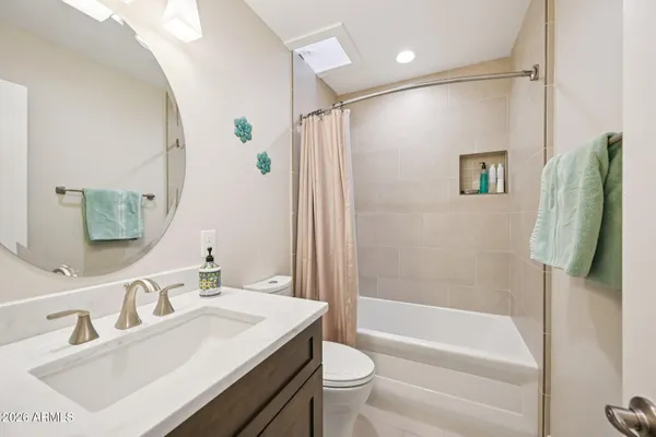 a bathroom with a shower and toilet