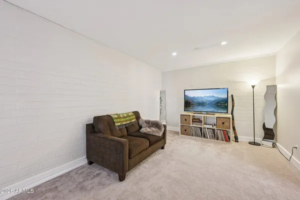 a living room with furniture and a window