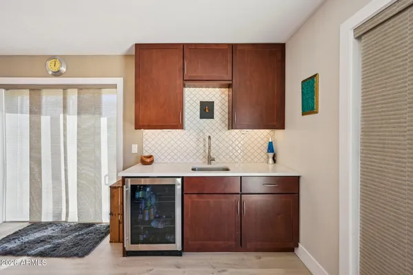 a picture of a bathroom with a refrigerator