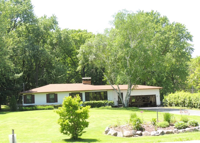 535 North County Road Bloomfield, WI 53128 - Photo 1 of 25 a front view of a house with yard swimming pool and outdoor seating