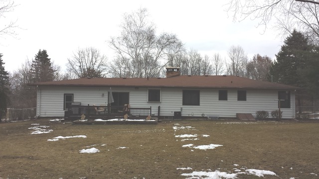 535 North County Road Bloomfield, WI 53128 - Photo 2 of 25 a front view of a house with yard and trees