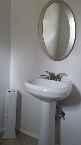 535 North County Road Bloomfield, WI 53128 - Photo 11 of 25 a bathroom with a sink and mirror