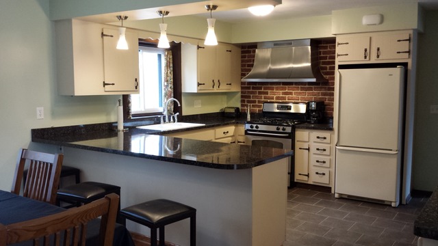 535 North County Road Bloomfield, WI 53128 - Photo 13 of 25 a kitchen with appliances a sink and cabinets