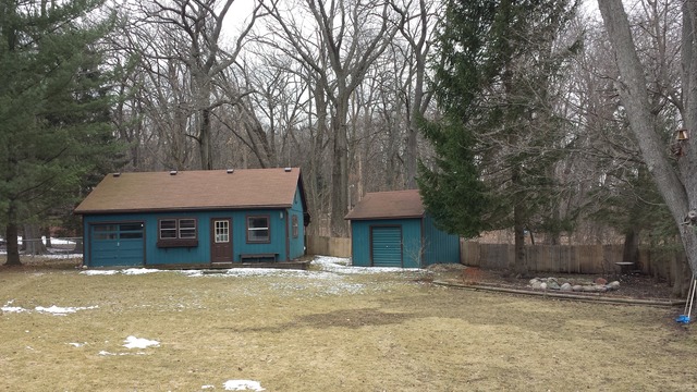 535 North County Road Bloomfield, WI 53128 - Photo 3 of 25 a front view of a house with a yard and garage