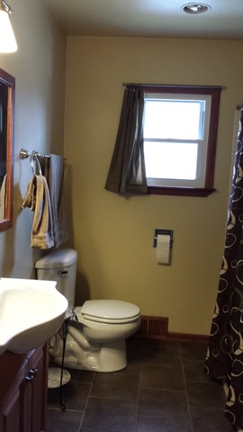 535 North County Road Bloomfield, WI 53128 - Photo 10 of 25 a bathroom with a toilet a sink and mirror