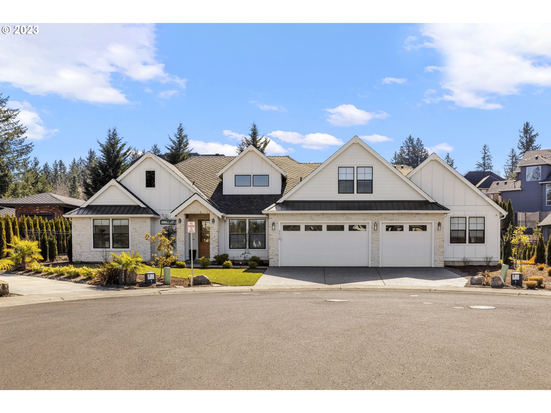 3410 Northwest McMaster Drive Camas, WA 98607 - Photo 1 of 43 a view of a white house with a big yard and large trees