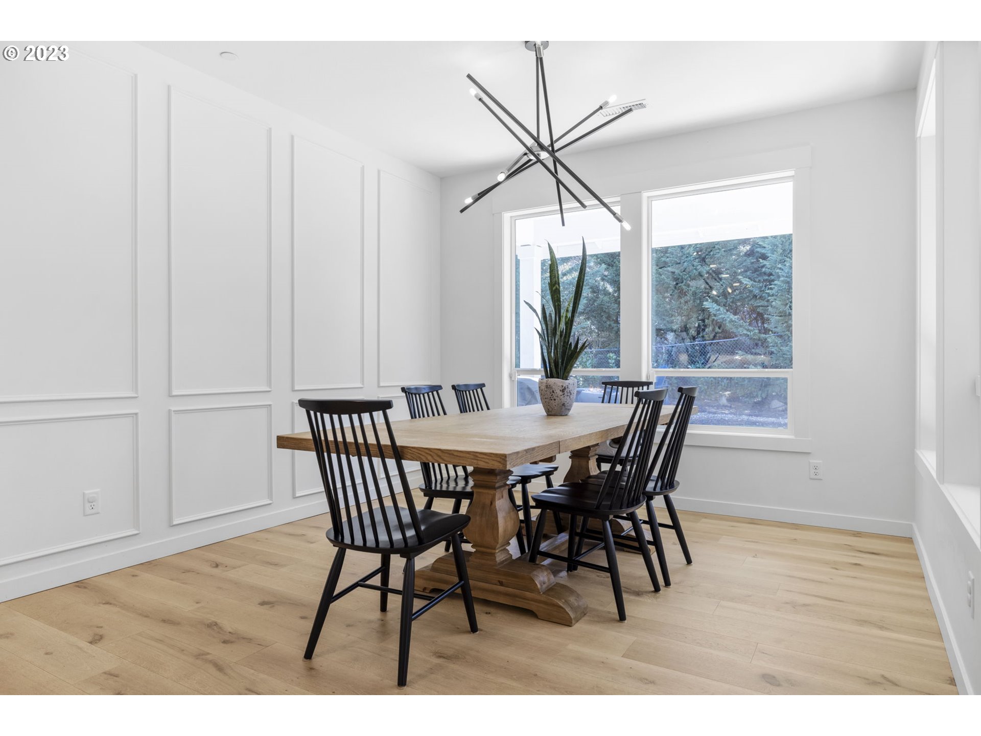 3410 Northwest McMaster Drive Camas, WA 98607 - Photo 12 of 43 a dining room with furniture a chandelier and wooden floor