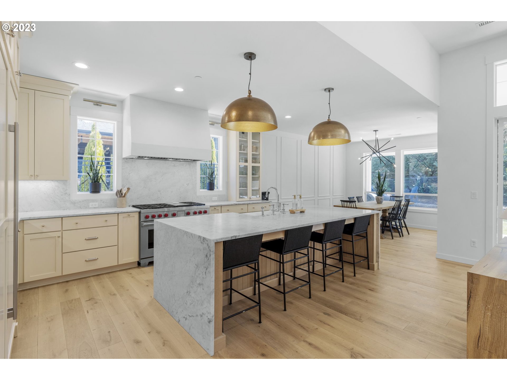 3410 Northwest McMaster Drive Camas, WA 98607 - Photo 14 of 43 a kitchen with center island table and chairs in it