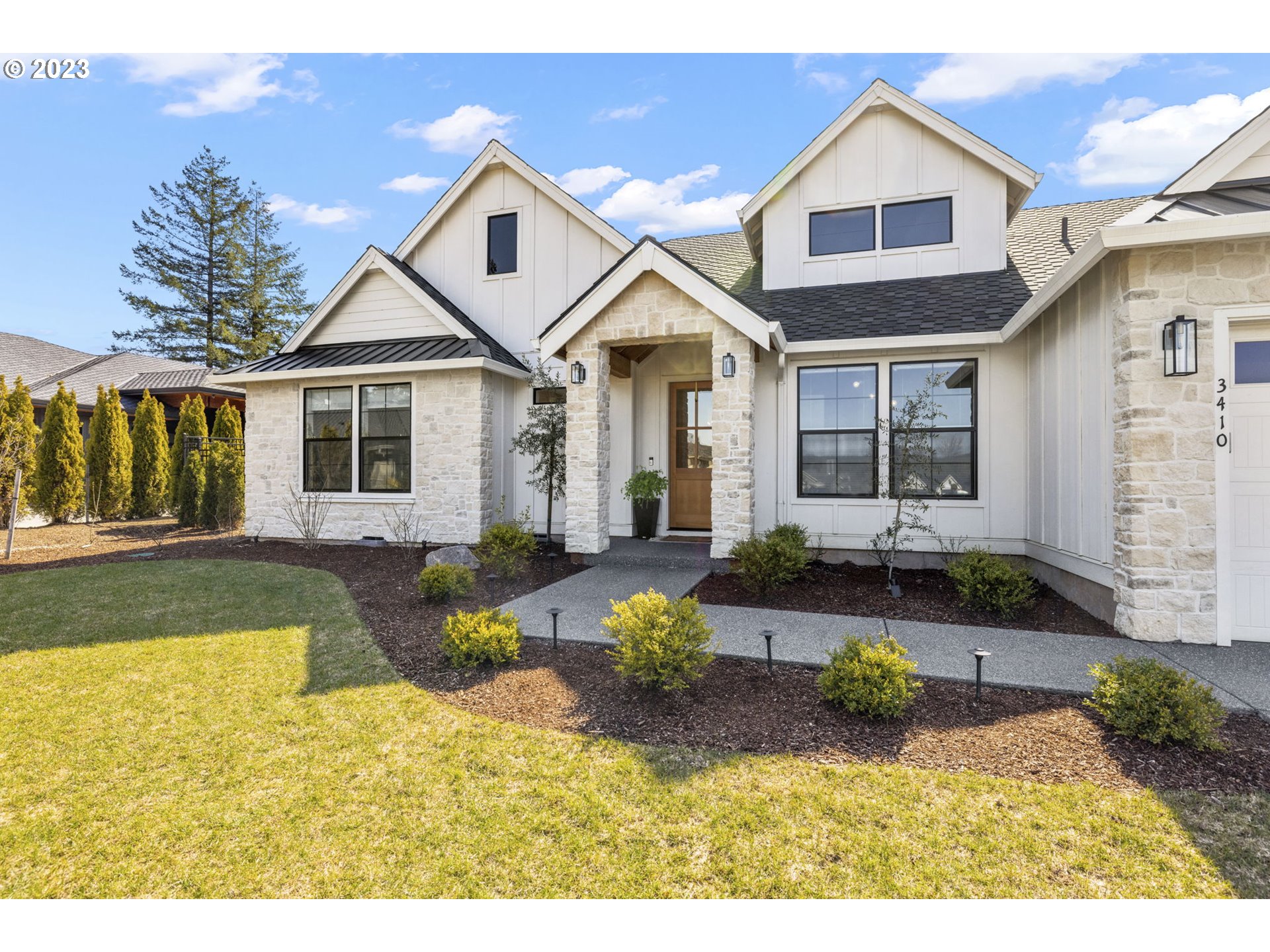 3410 Northwest McMaster Drive Camas, WA 98607 - Photo 2 of 43 a front view of a house with a yard