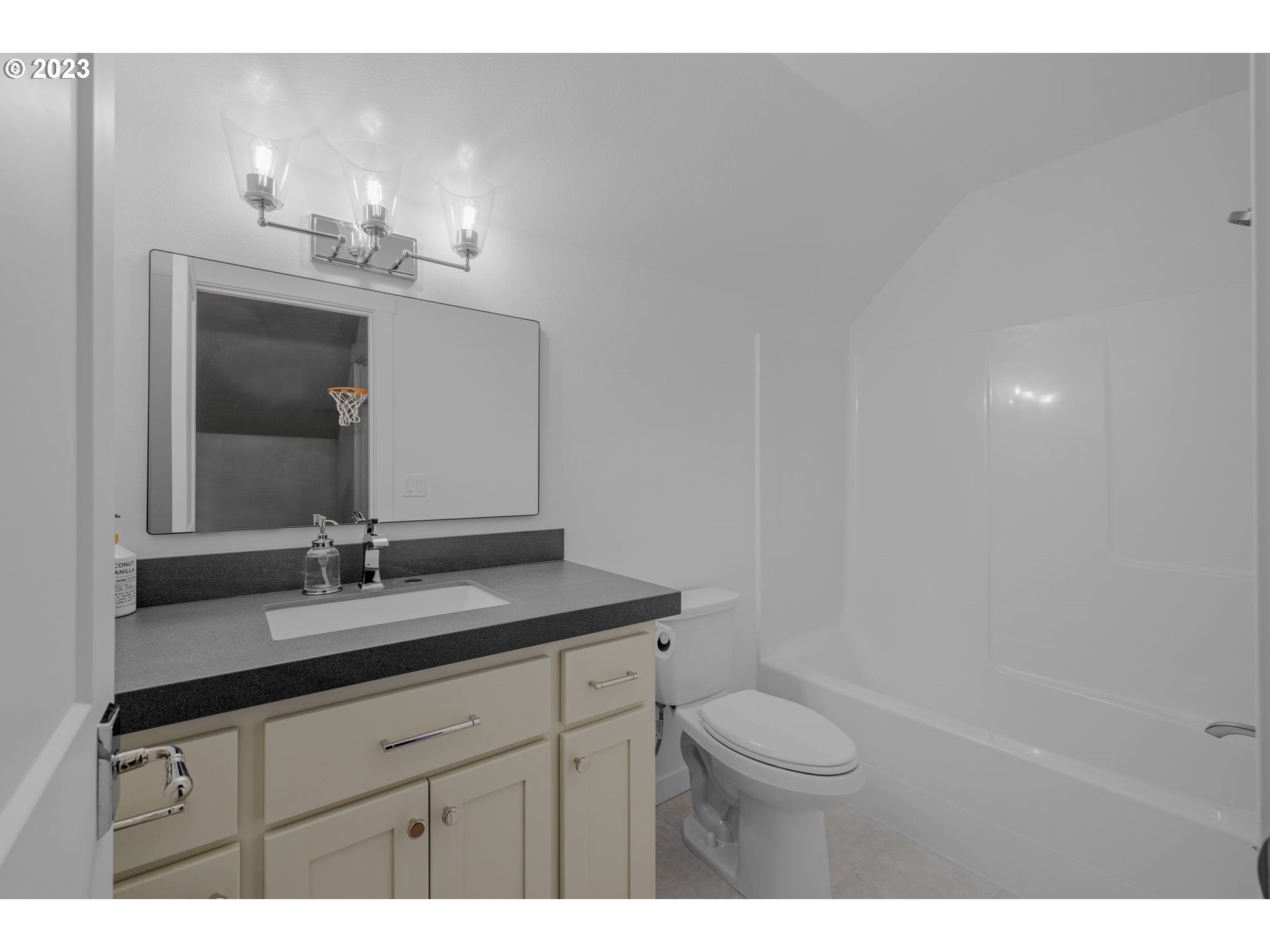 3410 Northwest McMaster Drive Camas, WA 98607 - Photo 32 of 43 a bathroom with a sink a toilet and a mirror