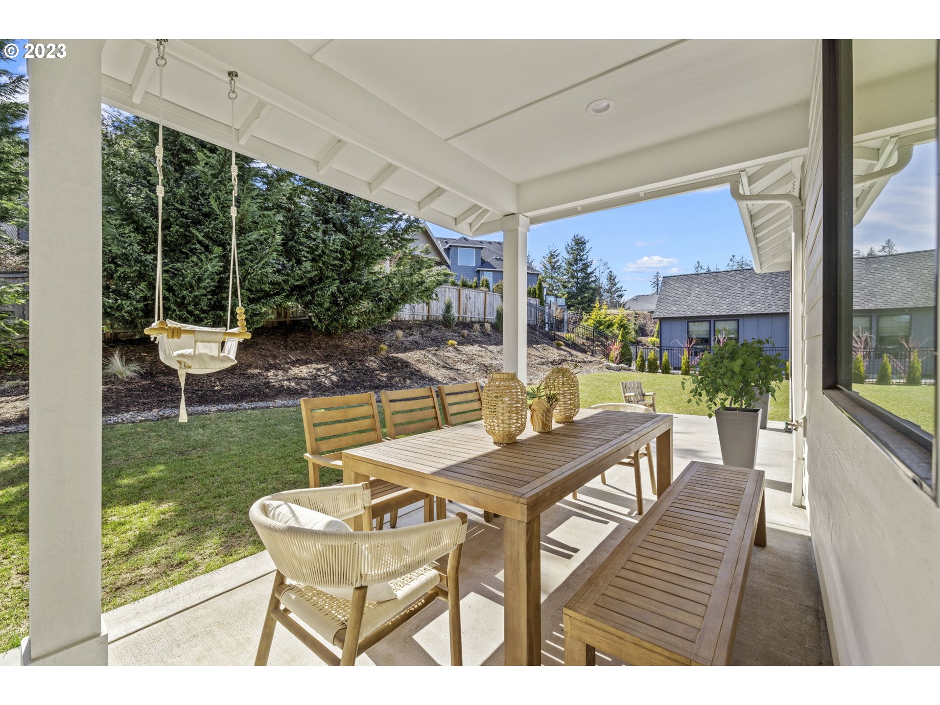 3410 Northwest McMaster Drive Camas, WA 98607 - Photo 38 of 43 a view of a patio with table and chairs potted plants and palm tree