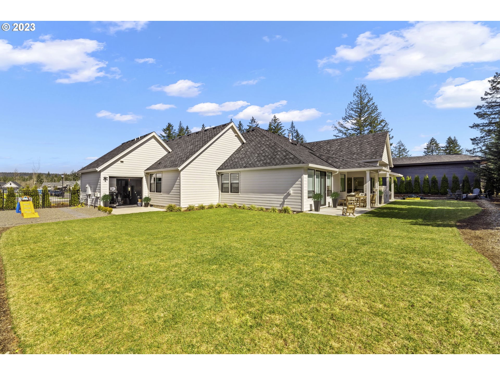 3410 Northwest McMaster Drive Camas, WA 98607 - Photo 41 of 43 a white house with a big yard and large tree