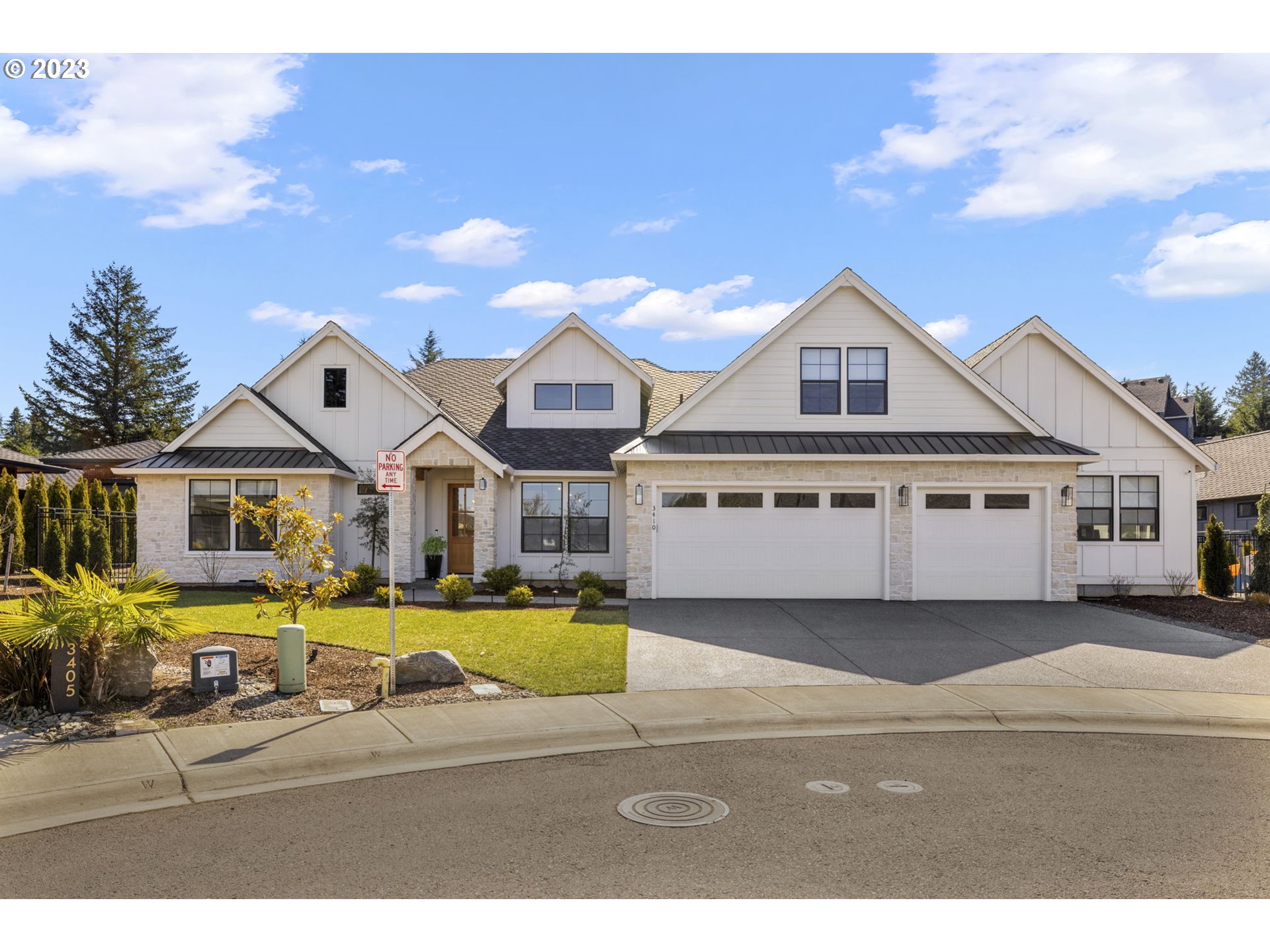 3410 Northwest McMaster Drive Camas, WA 98607 - Photo 43 of 43 a view of a big house with a big yard and large trees