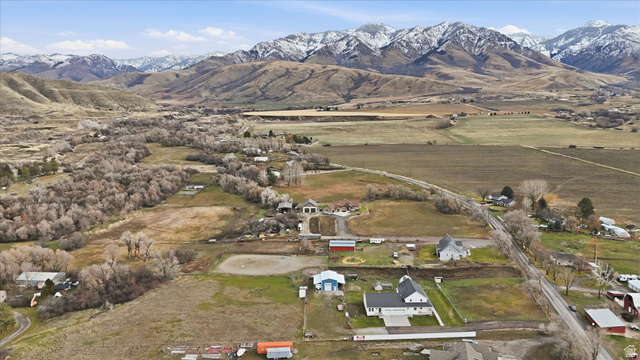 1009 High Creek Road Cove, UT 84320 - Photo 76 of 79 Aerial overview of property's location featuring a mountainous background and rural landscape