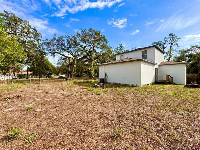 a backyard of a house with lots of green space