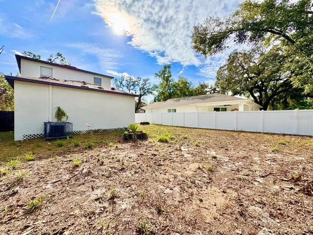a view of a backyard of the house