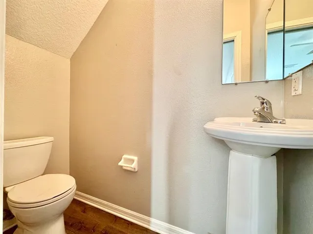 a bathroom with a sink and a toilet