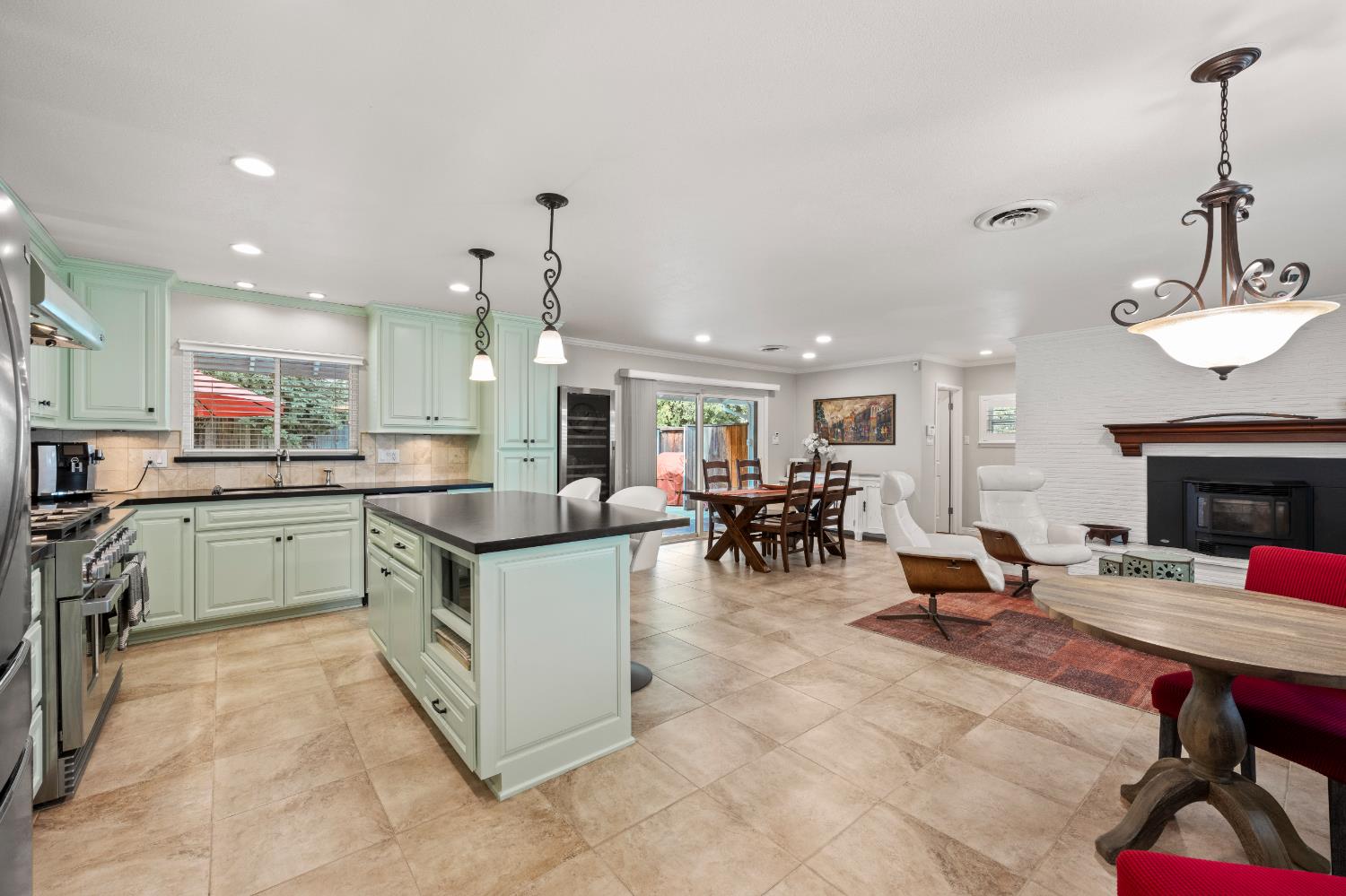 1325 Philomene Court Carmichael, CA 95608 - Photo 11 of 40 a kitchen with cabinets and chairs