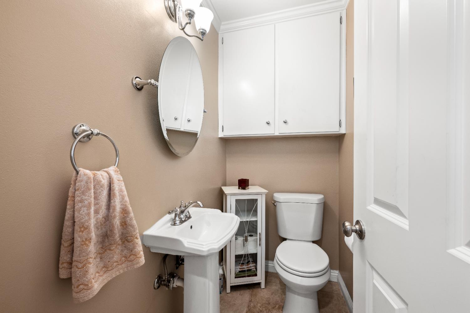 1325 Philomene Court Carmichael, CA 95608 - Photo 18 of 40 a bathroom with a toilet sink and mirror