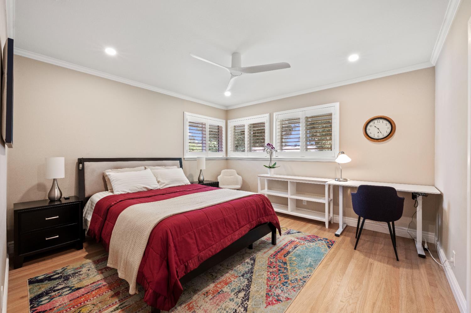 1325 Philomene Court Carmichael, CA 95608 - Photo 19 of 40 a bedroom with a bed and a chandelier