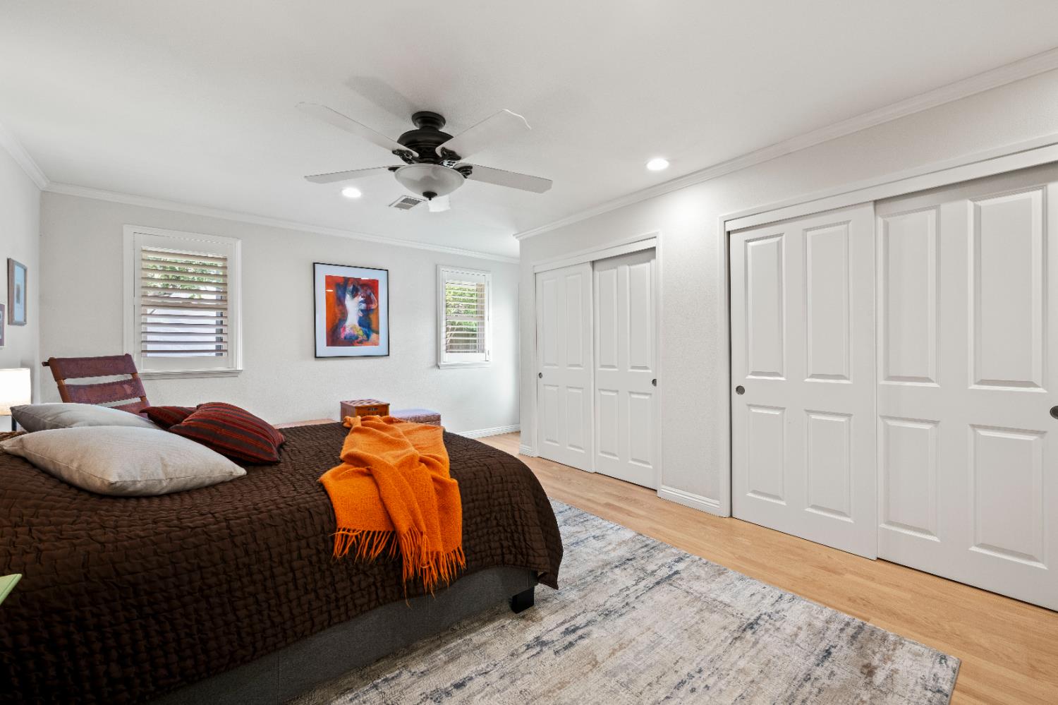 1325 Philomene Court Carmichael, CA 95608 - Photo 22 of 40 a bedroom with a bed and a chandelier