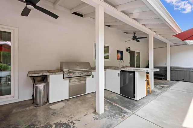 a kitchen with a stove and a refrigerator