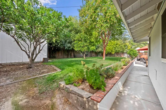 a view of a backyard with garden