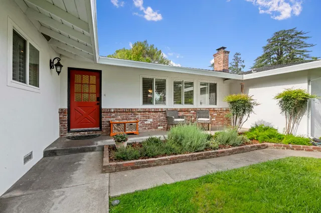 a front view of a house with garden