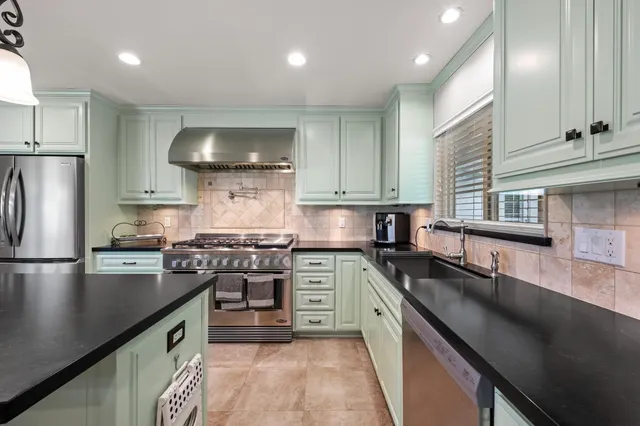 a kitchen with a stove and a sink