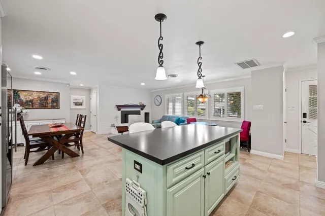a kitchen that has a lot of cabinets in it