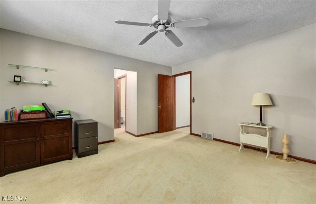22536 Center Ridge Road, Unit A Rocky River, OH 44116 - Photo 28 of 32 Bedroom featuring light colored carpet and ceiling fan