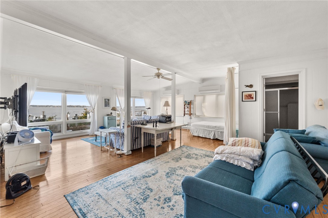 90 Deep Harbor Road Lancaster, VA 22503 - Photo 11 of 21 a living room with furniture and a table
