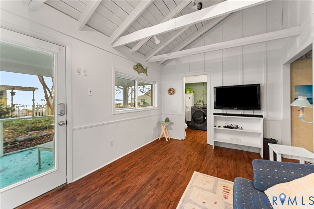 90 Deep Harbor Road Lancaster, VA 22503 - Photo 13 of 21 a living room with furniture and a flat screen tv